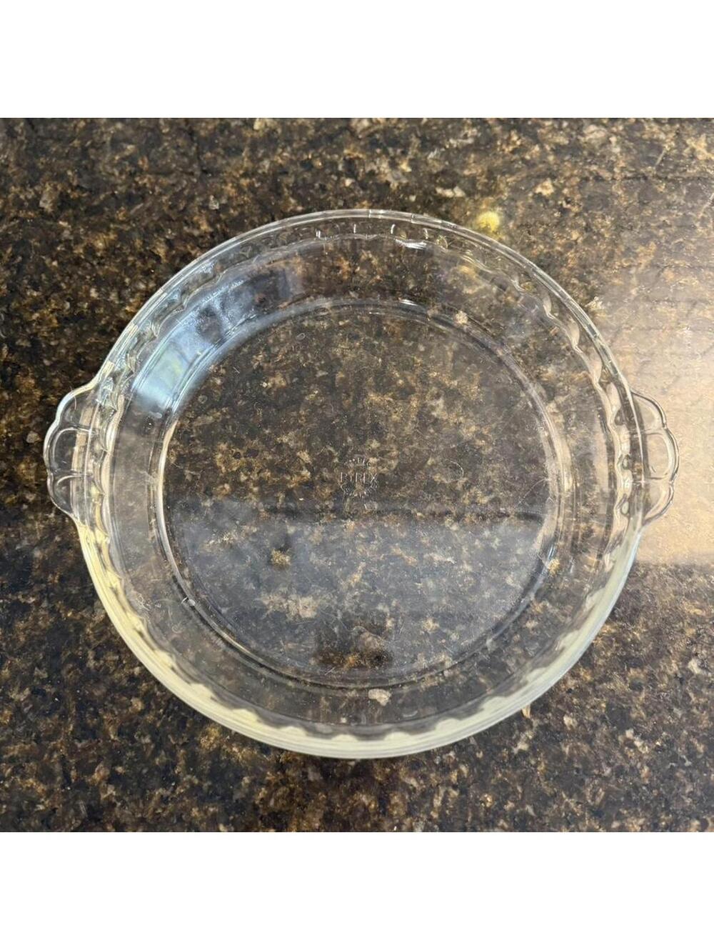 Vintage Pyrex pie plate with fluted edges and handles.